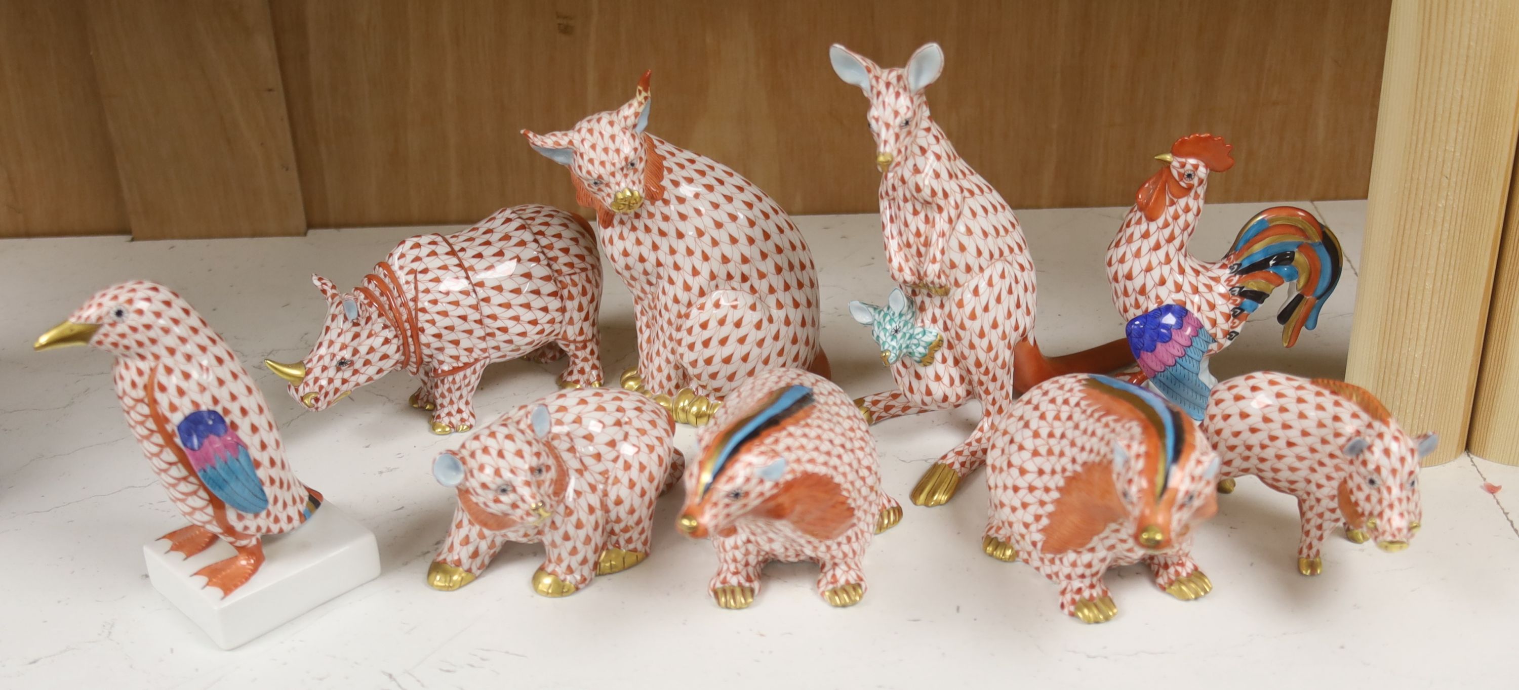 Nine Herend red ‘fishnet’ porcelain animal and bird figures,